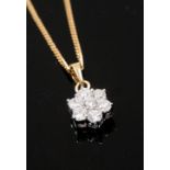 ***COLLECTED BY MR ANDREWS 23/07 DH**** An 18ct gold flower cluster pendant set with brilliant cut