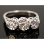 ***COLLECTED BY MR ANDREWS 23/07 DH**** An 18ct white gold three stone ring set with brilliant cut