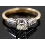 An 18ct gold diamond ring, the central brilliant cut single stone of approximately 0.