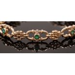 A modern 9ct gold bracelet set with emeralds and diamonds, heart padlock fastener,