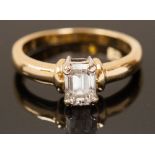 ***COLLECTED BY VENDOR 29/07 DH** A solitaire diamond ring, claw set emerald cut diamond of approx.