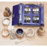 A collection of silver plated items to include napkin rings and a cruet set.