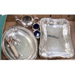 A pair of Edwardian silver salts, wavy outline and blue glass liners, Birmingham 1905,