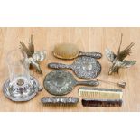 A group of silver plated wares to include two cockerels and a silver backed mirror, brush and comb,