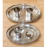 A collection of plated ware, comprising two trays, cup holders,
