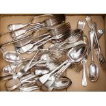 A collection of assorted silver plated flatware, including dinner forks, table spoons, dessert
