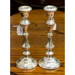 A pair of Elizabeth II sterling silver candlesticks in the Georgian style, of turned baluster form,