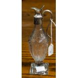 A George III cut glass and silver mounted vinegar bottle with silver hinged cover and reeded handed