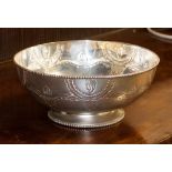 An Asian silver circular bowl on spreading circular foot with bead edge,