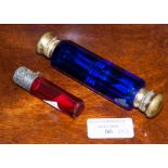 A cranberry and silver mounted cylindrical scent bottle and stopper,