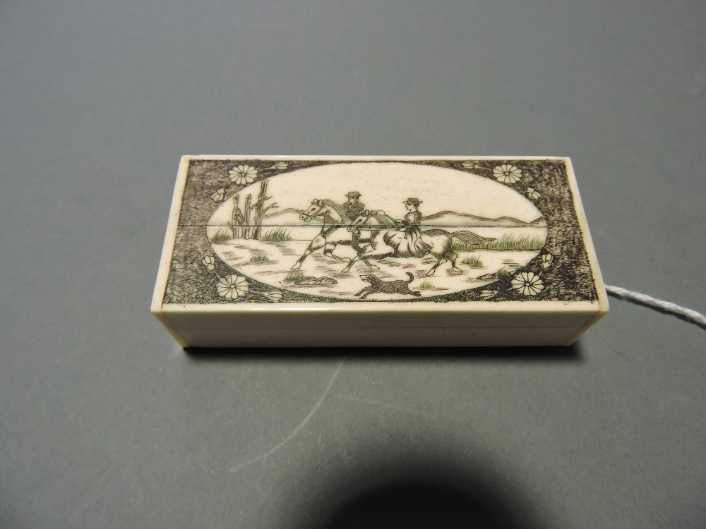 A scrimshaw-style rectangular bone box,