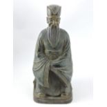 A bronze figure of a scholar, with trace