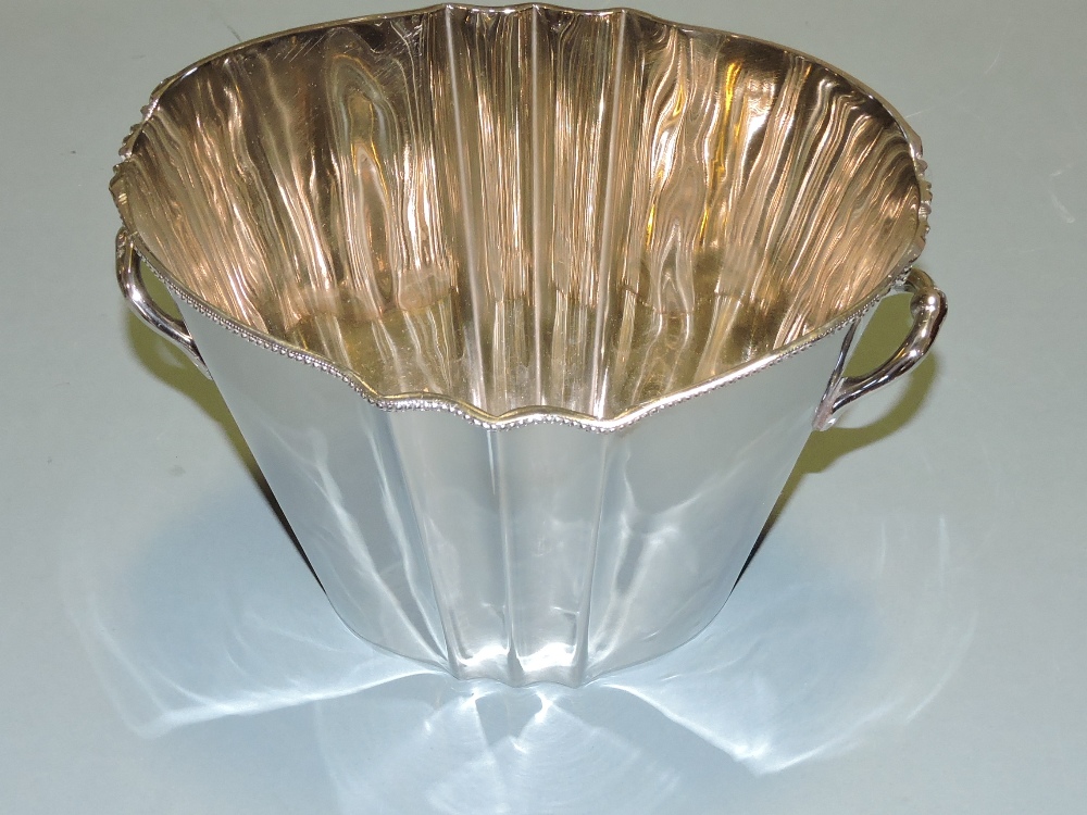 A pair of oval plated 2 handled wine coo