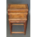 A nest of three oriental hardwood tables