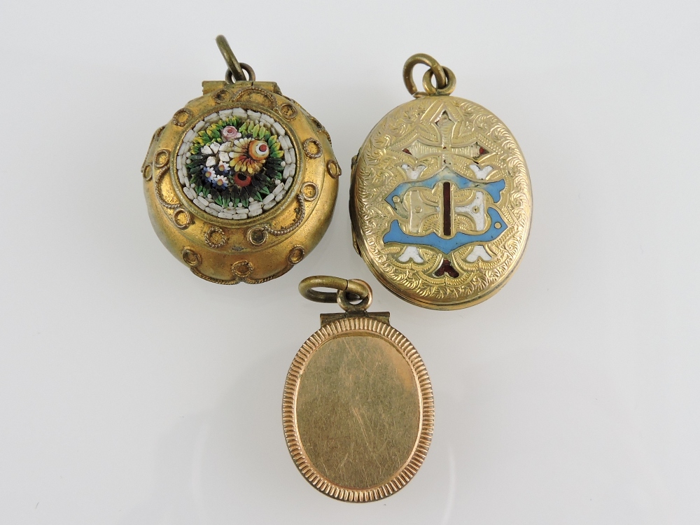 A yellow metal and enamel locket, engrav