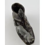 A cast brass patinated shoe, with cat an