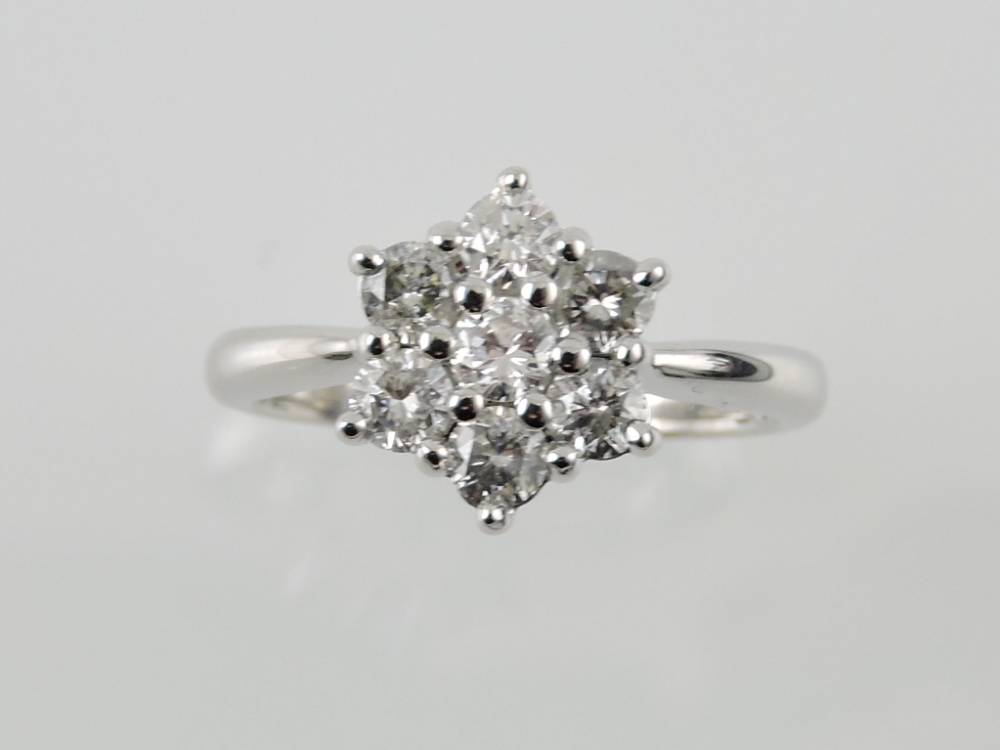 An 18ct white gold diamond daisy cluster