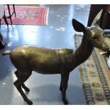 A life-size cast bronze standing fawn, w