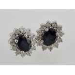 A pair of 18ct white gold sapphire and d