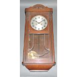 An early 20th century wall clock by Mull