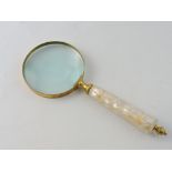 A table magnifying glass, brass mounted