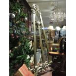 A silver gilt wood easel, with baroque c