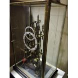 A brass skeleton clock, the lancet shape