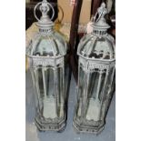 A pair of verdigris metal octagonal tall