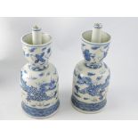 A pair of blue and white candlesticks, d