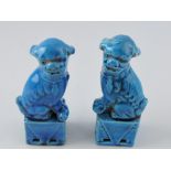 A pair of turquoise glazed temple dogs,