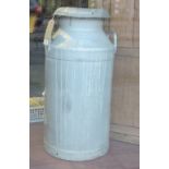 A vintage aluminium milk churn and cover