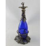 A Victorian style blue glass decanter on