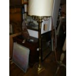 A four armed brass floor lamp, having st