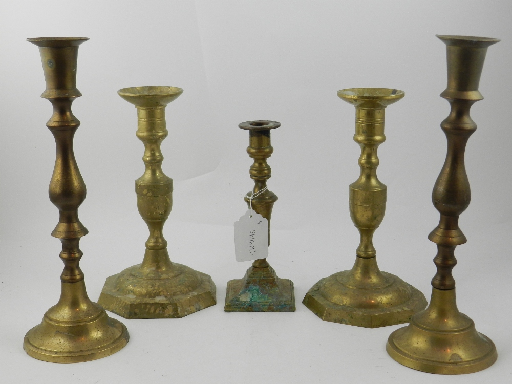 A pair of brass candlesticks, having kno