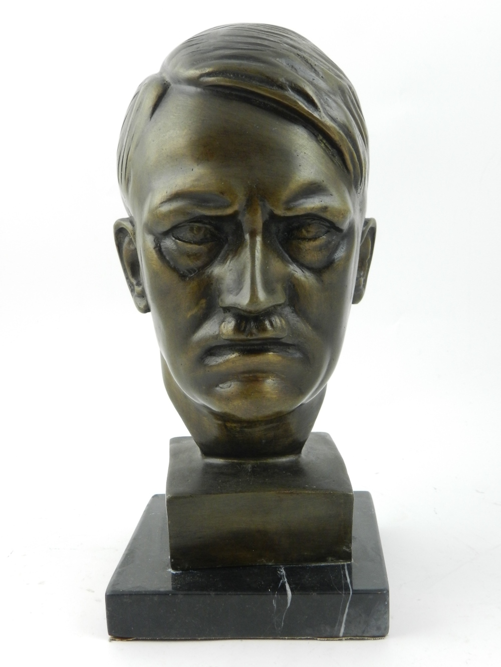 A cast metal bust of a gentleman head, r