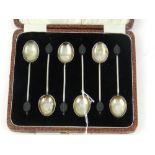 A cased set of six silver coffee spoons,