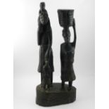 An African carved wooden figurine, depic
