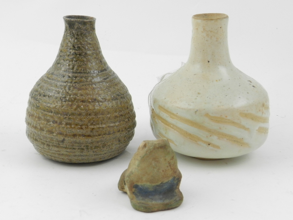 A pair of stoneware miniature glazed vas