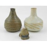 A pair of stoneware miniature glazed vas