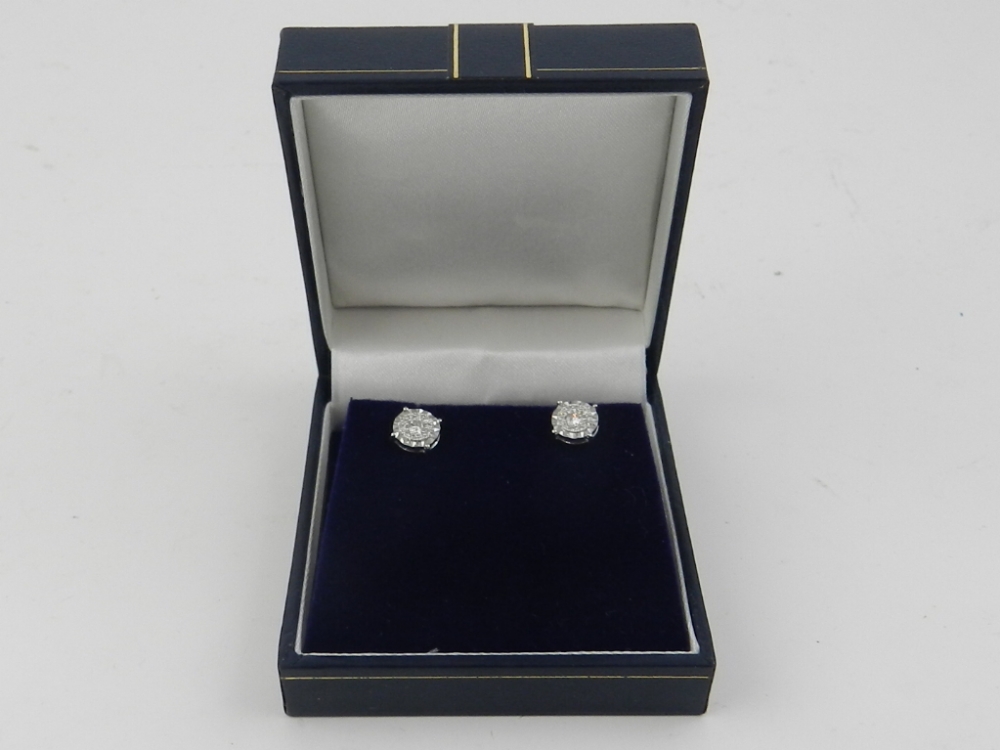 A pair of 18 carat white gold and diamon