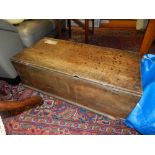 An 18th century oak and elm coffer, the