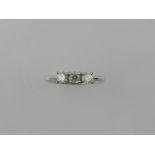 An 18 carat white gold three stone diamond ring, the diamonds approx. 0.50 carats combined.