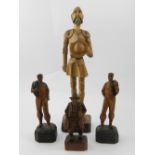 A collection of four wooden carved figur