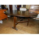 Ercol,England. A drop leaf table with ou