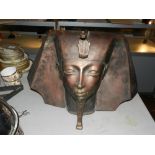 A 20th century copper bust of an Egyptia