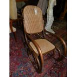 A Thonet style bent beechwood and caned