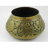 A Islamic style brass jardiniere, emboss