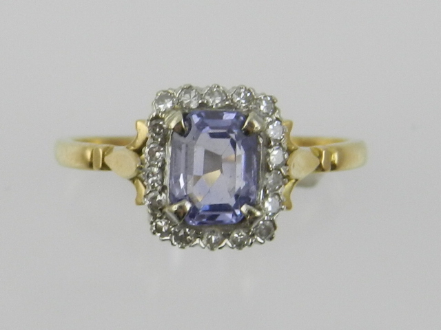 A yellow metal, diamond and sapphire set