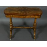 A mid Victorian figured walnut card tabl