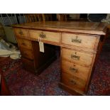 A Victorian walnut pedestal desk, having